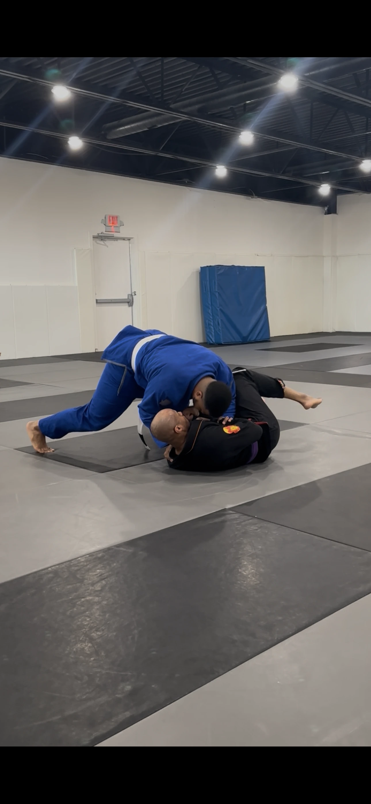 An adult class working positions together