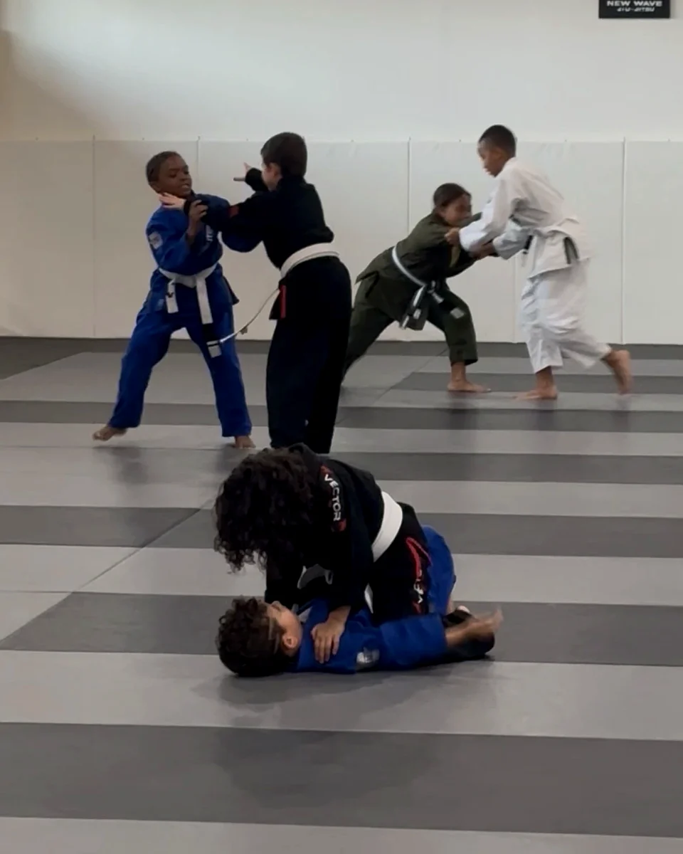 Young students learning a technique with a partner