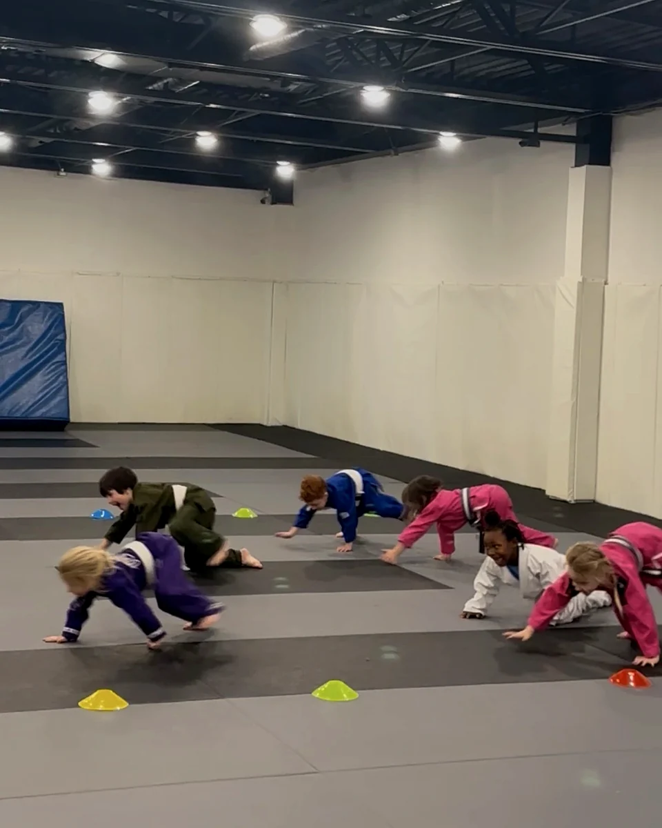 Kids celebrating progress after training